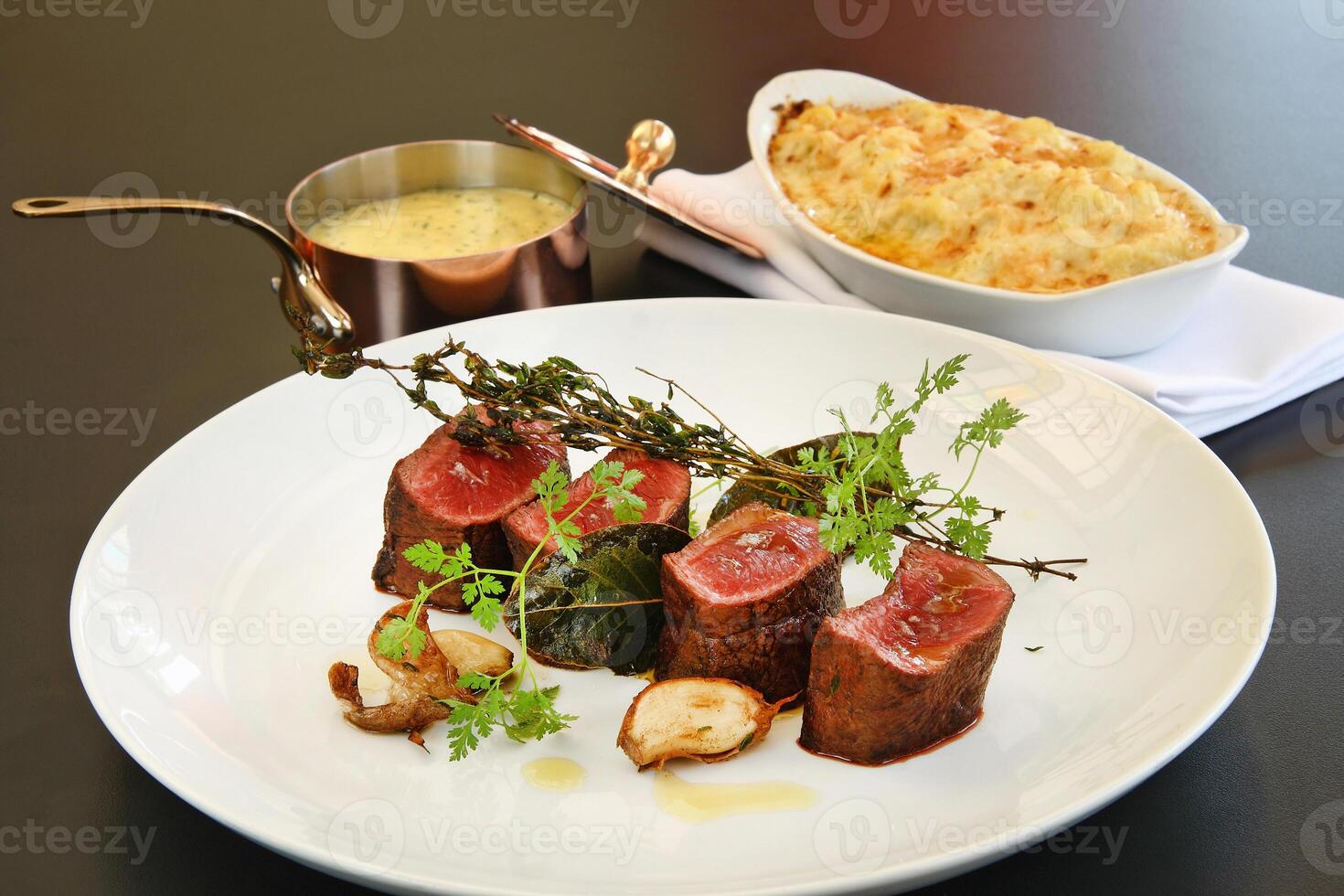 Rump tip with bernaise sauce on plate photo
