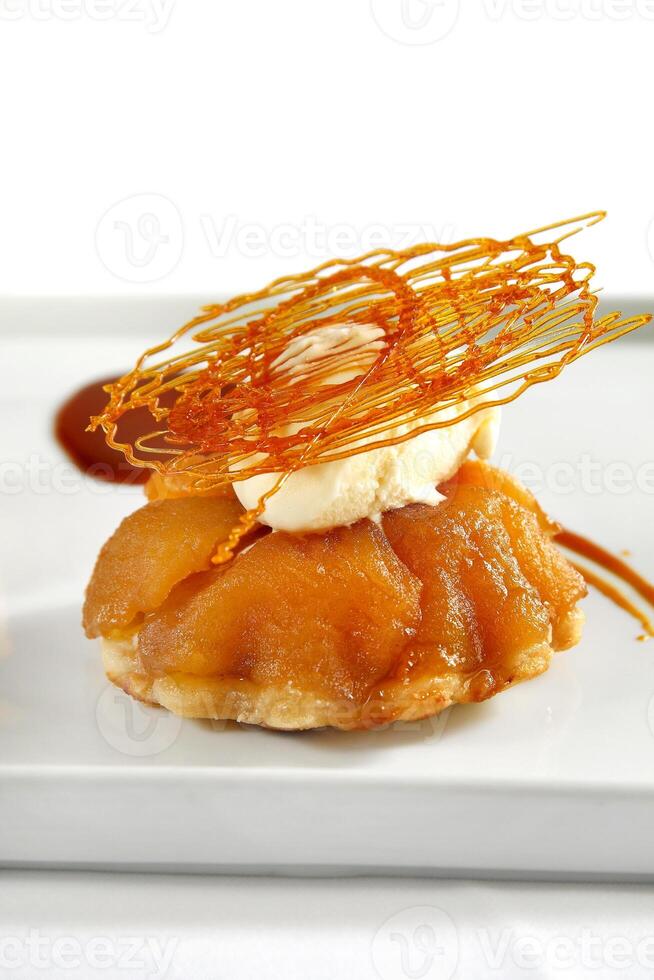 apple pie with caramel decoration photo