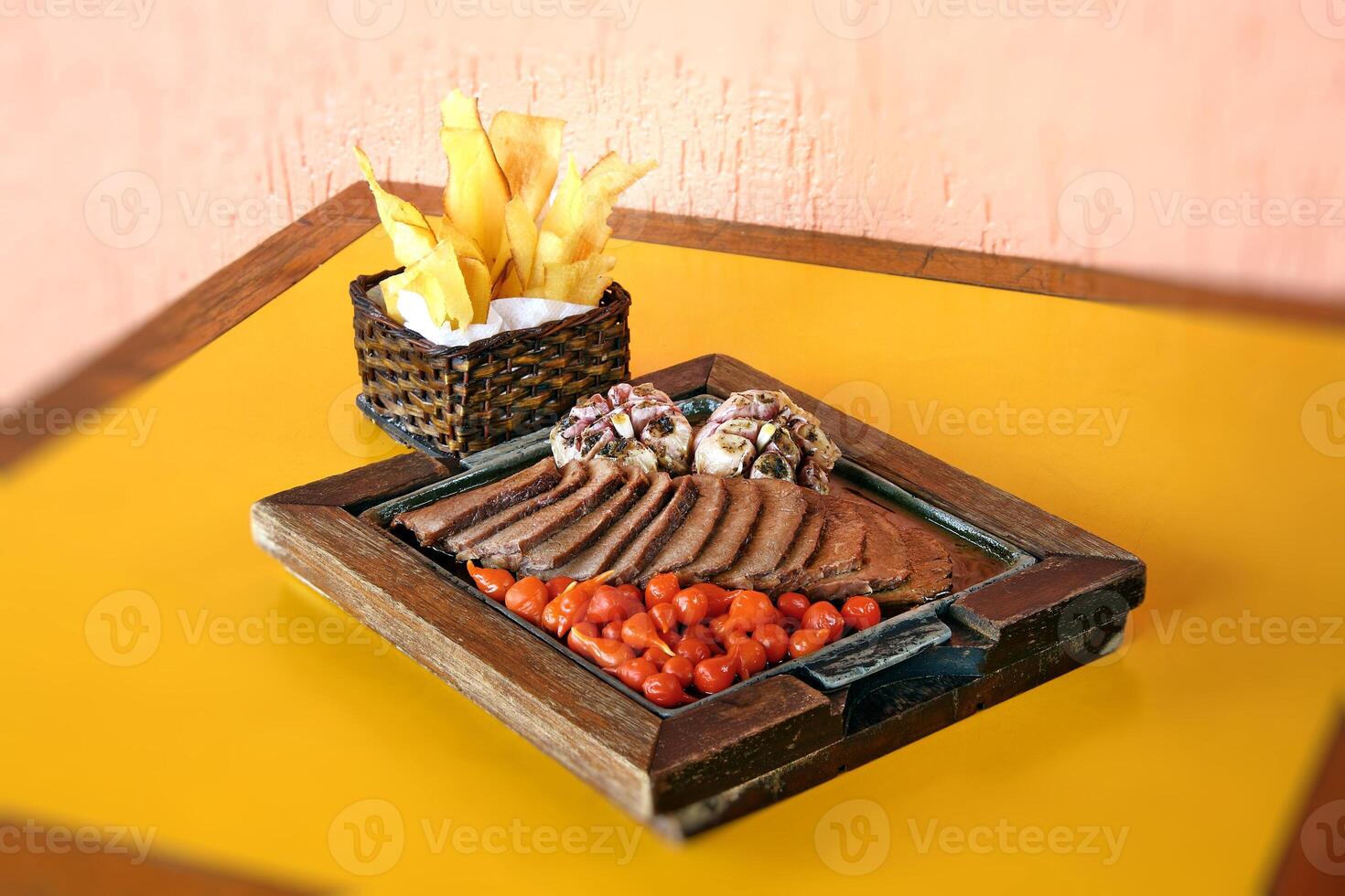 carne de sol, typical northeastern Brazilian dish with tomatoes and fried cassava photo