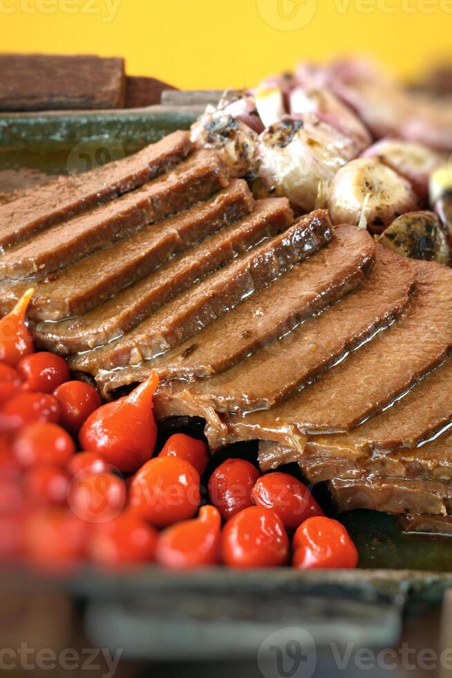 carne de sol, typical northeastern Brazilian dish with tomatoes and fried cassava photo