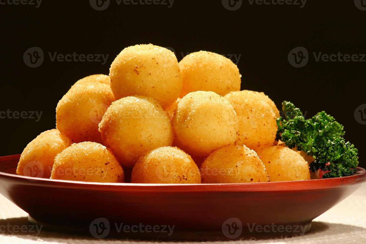 Fried dumpling stuffed with cheese on plate photo