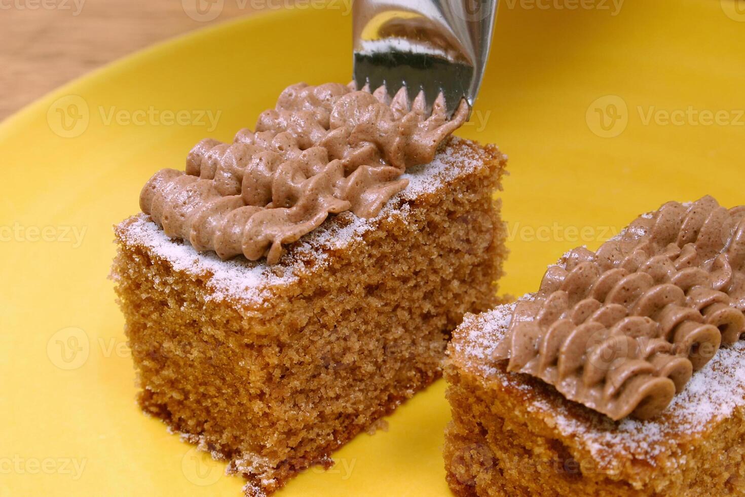 square walnut cakes with walnut cream icing photo