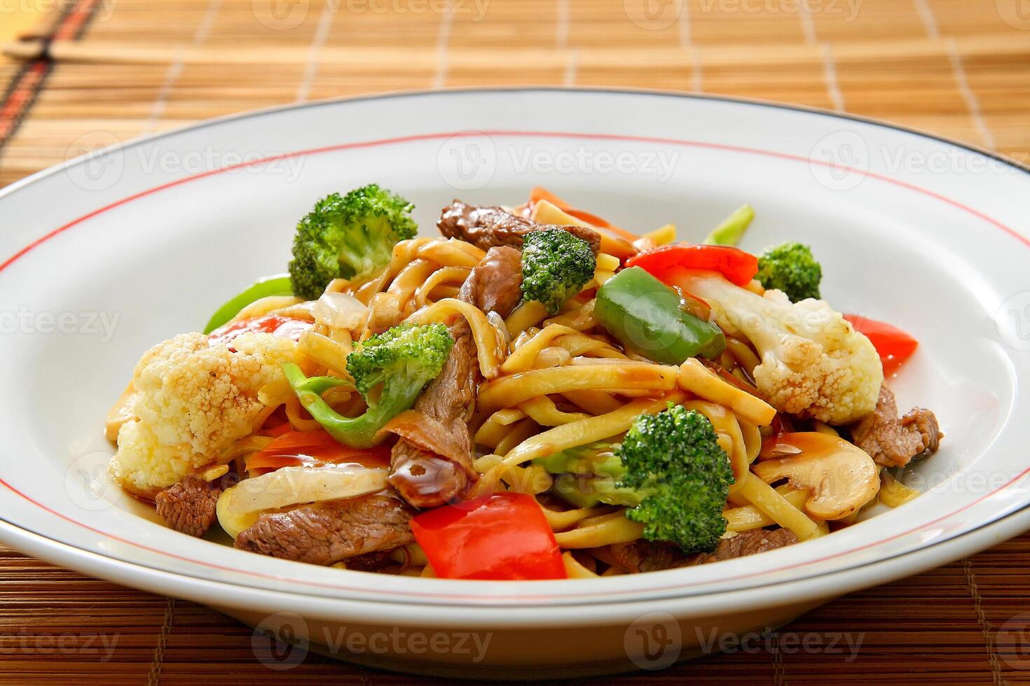 Classic yakisoba with meat, pasta and chopped vegetables photo