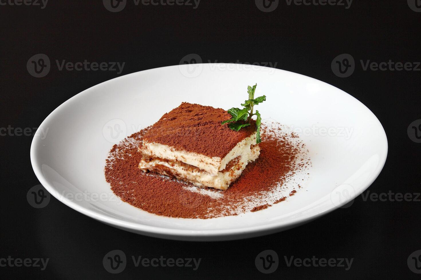Tiramisu, classic Italian dessert with cream and chocolate photo