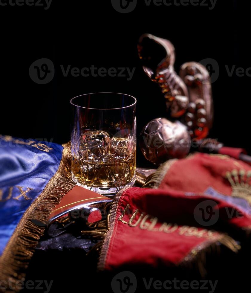 whiskey with ice over football club flag photo