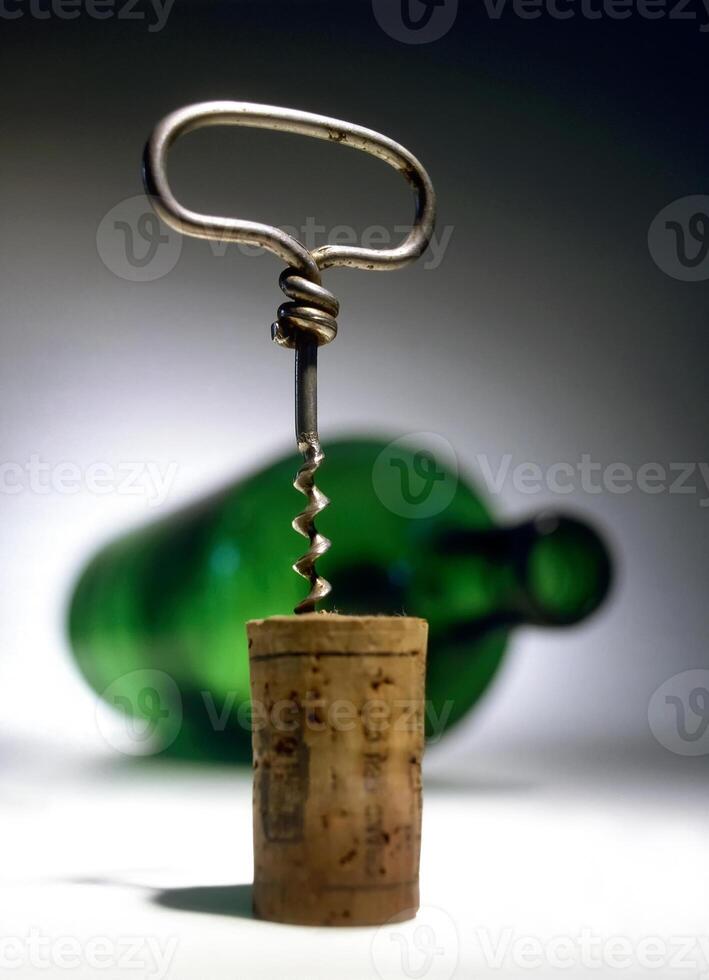 corkscrew with corks removed close-up photo