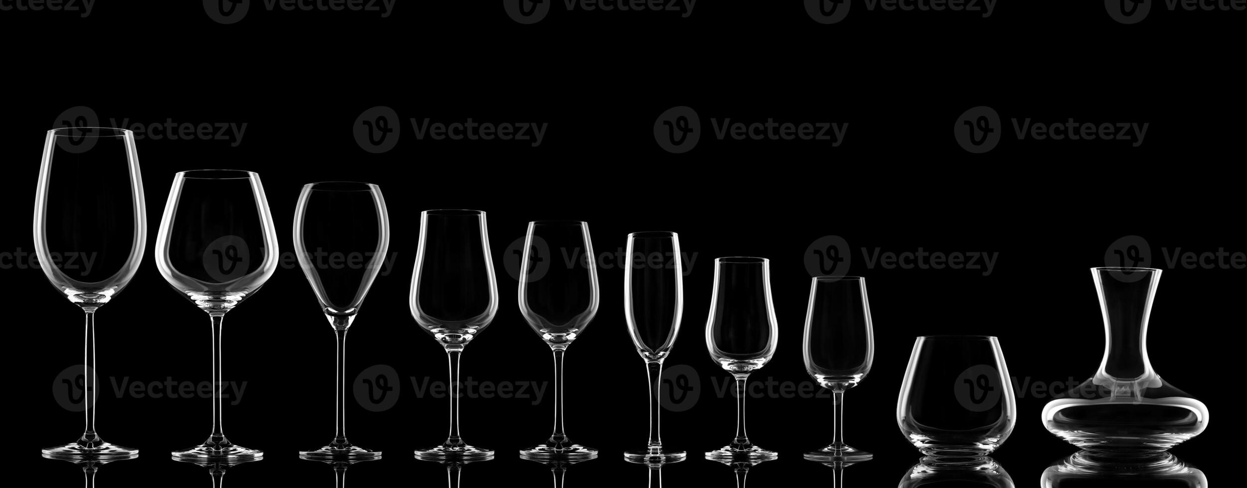 empty wine glasses specific to the type of wine on a black background photo