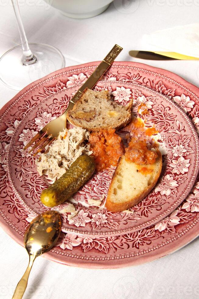 tasting home-made bread with sauces and pickles photo