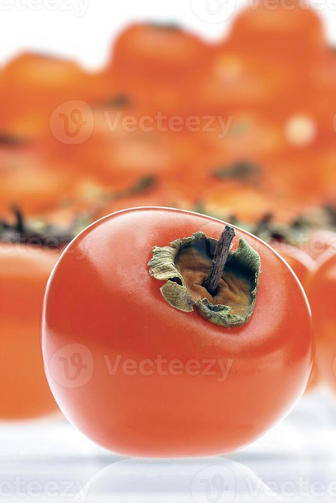 persimmon, juicy and delicious red fruit much appreciated in Brazil photo