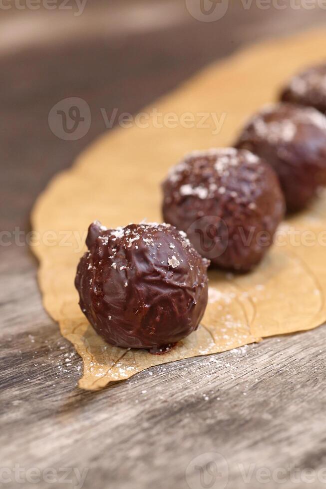 Chocolate truffles with 70 percent cocoa and nuts photo