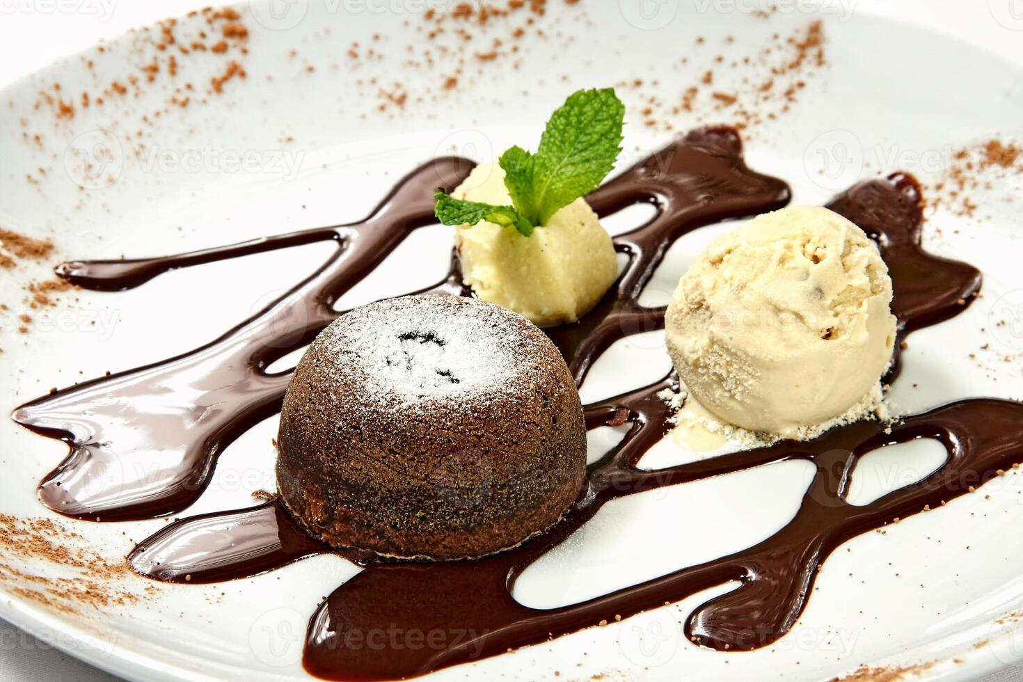 petit gateau with ice cream and syrup photo