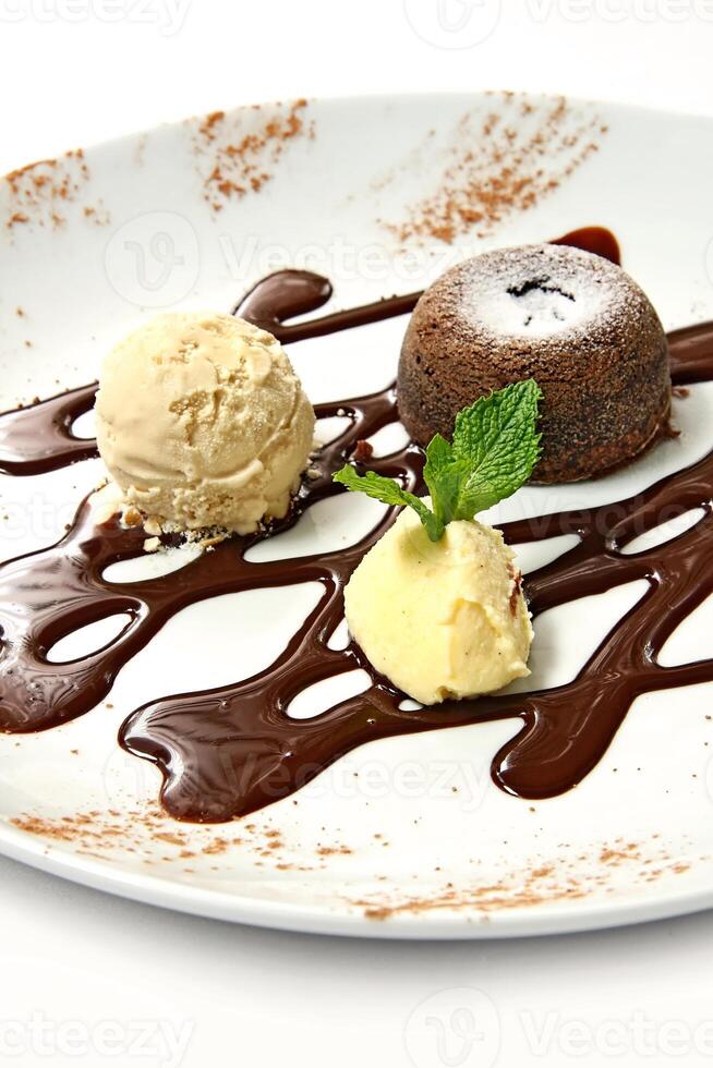 petit gateau with ice cream and syrup photo