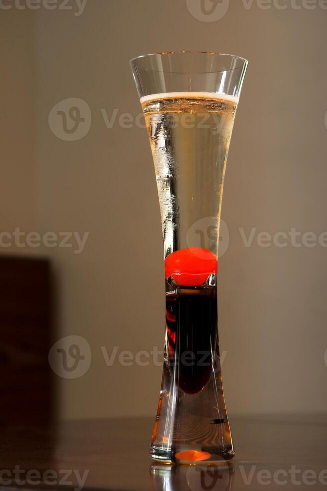 Kir Royal, classic drink with red fruits, cassis liqueur and brut champagne photo