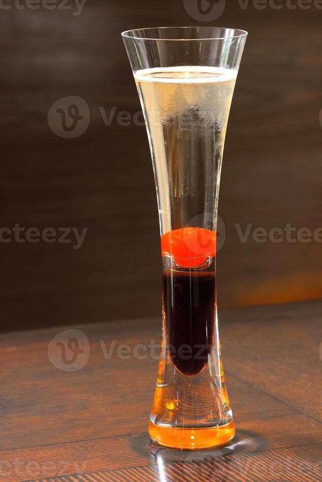 Kir Royal, classic drink with red fruits, cassis liqueur and brut champagne photo
