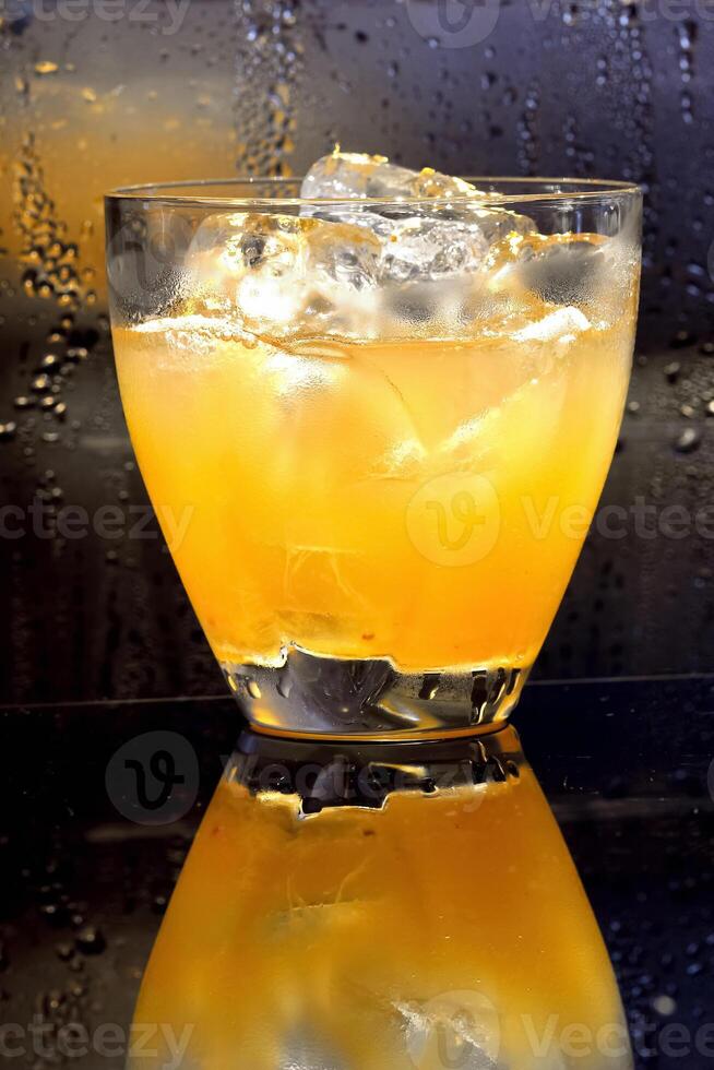 Cheetah, drink with gin, liqueur, peach tea, lemon and ice photo