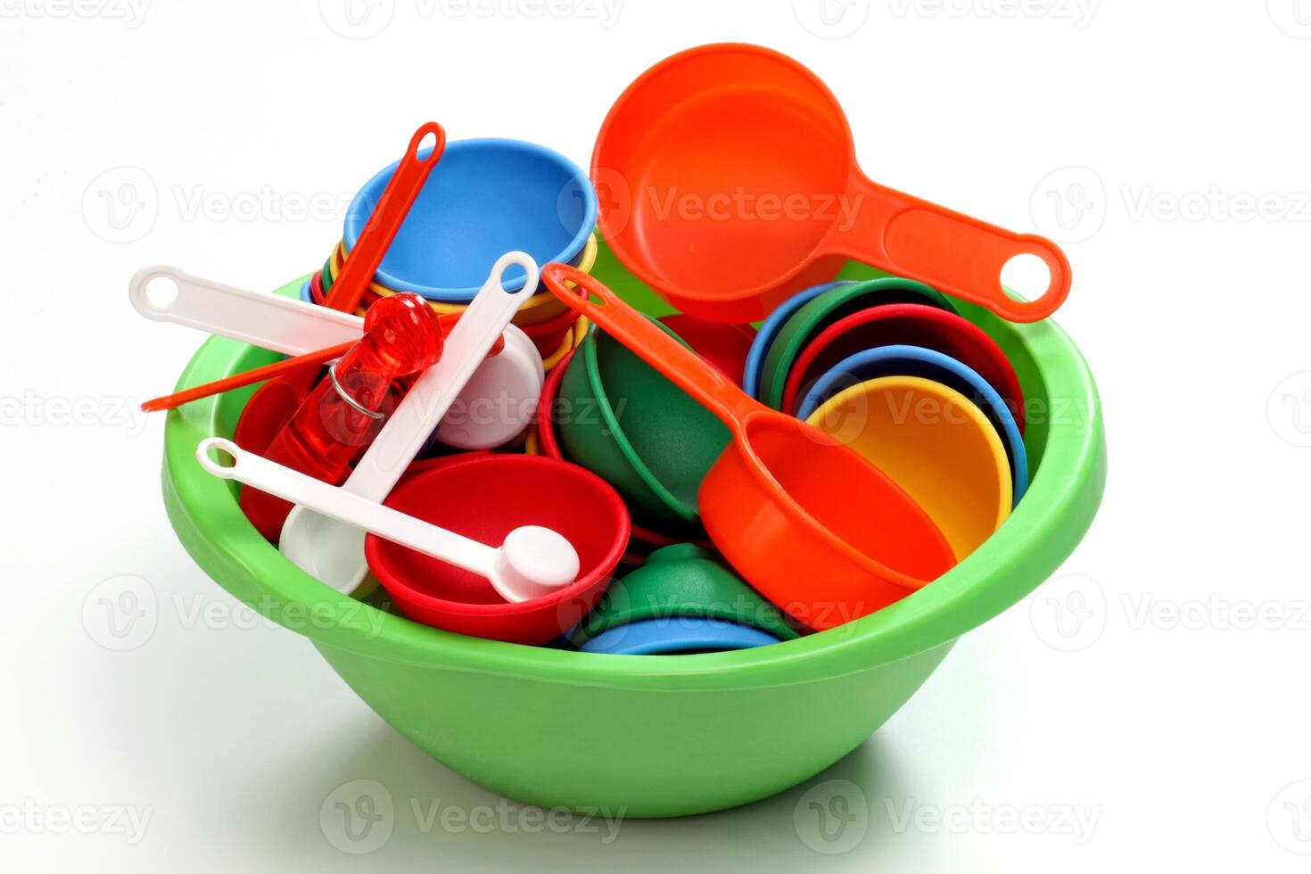 colorful kitchen utensils for children on neutral background photo