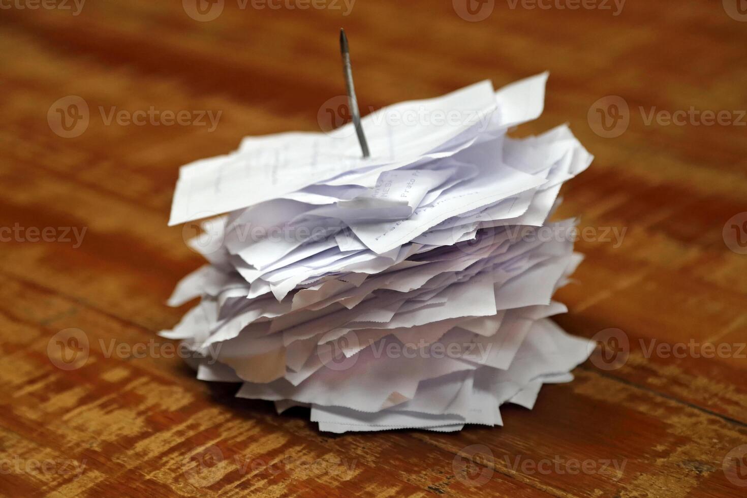 paper restaurant order nail on wooden table photo