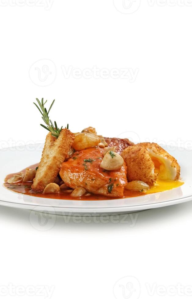 Chicken Marengo step by step, French recipe with chives, bouquet garni, carrots, orange juice and garlic among others photo
