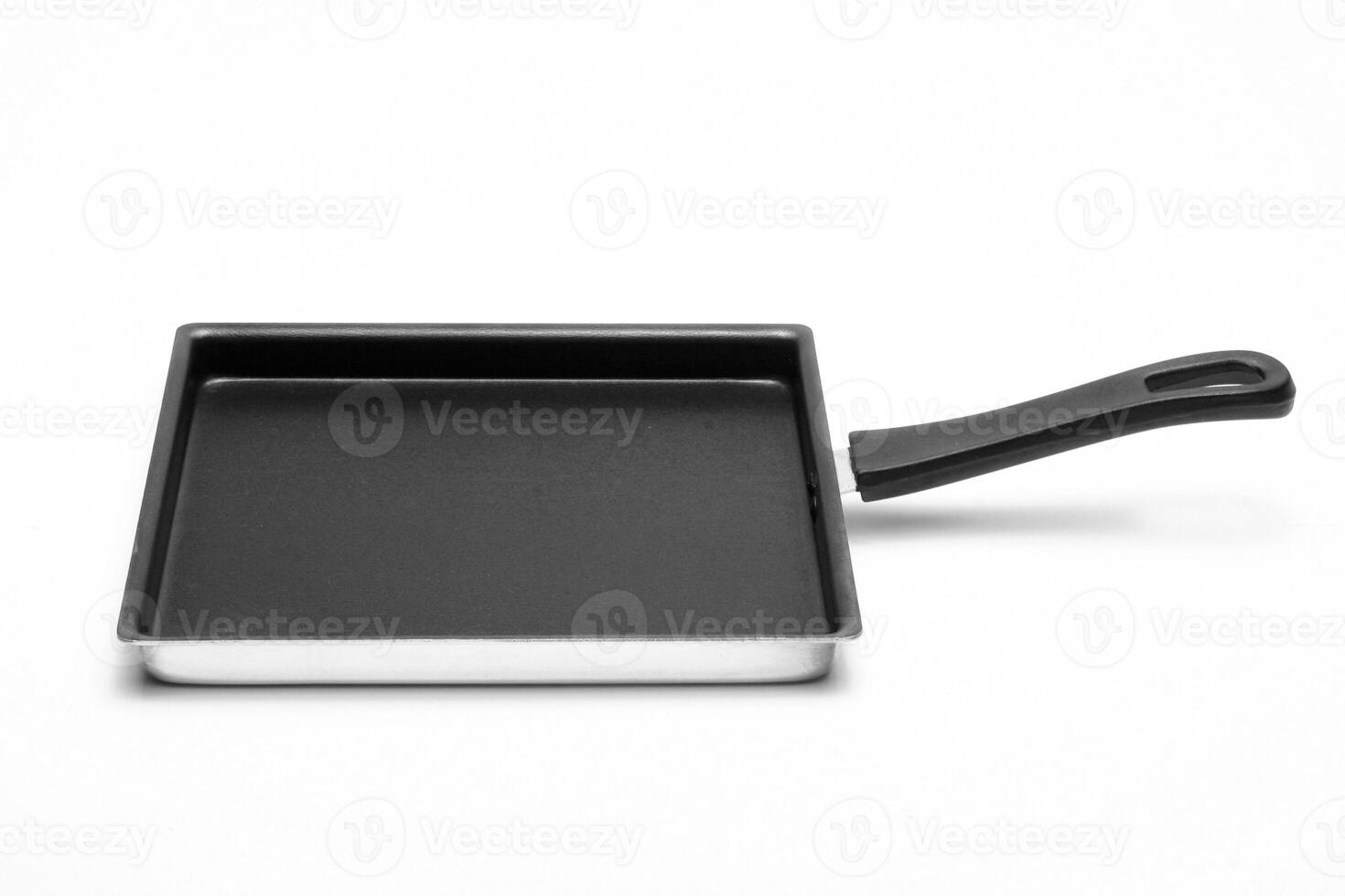 empty pan with black background on white background photo