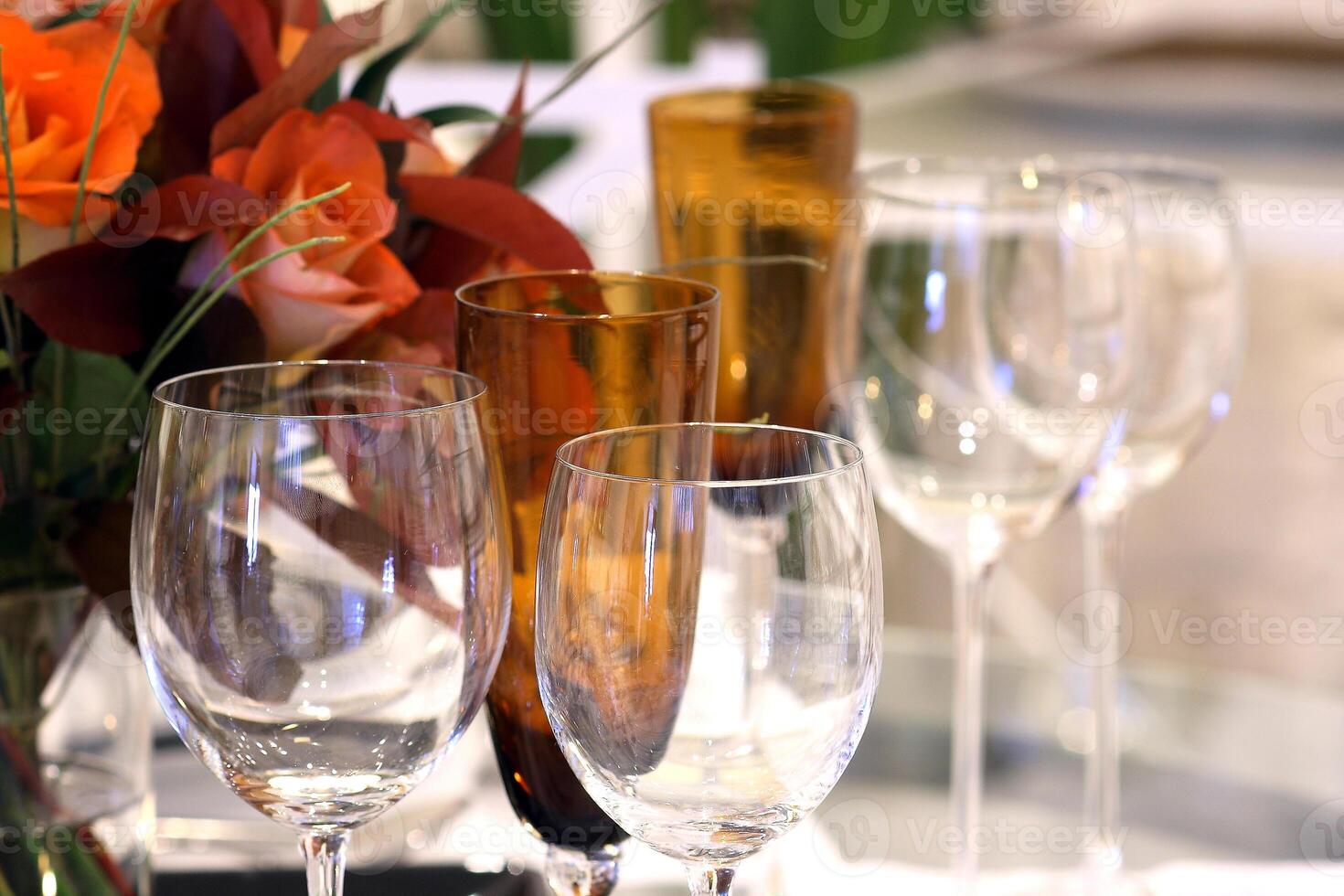 sophisticated tables with plates, cutlery and fine glasses close-up photo