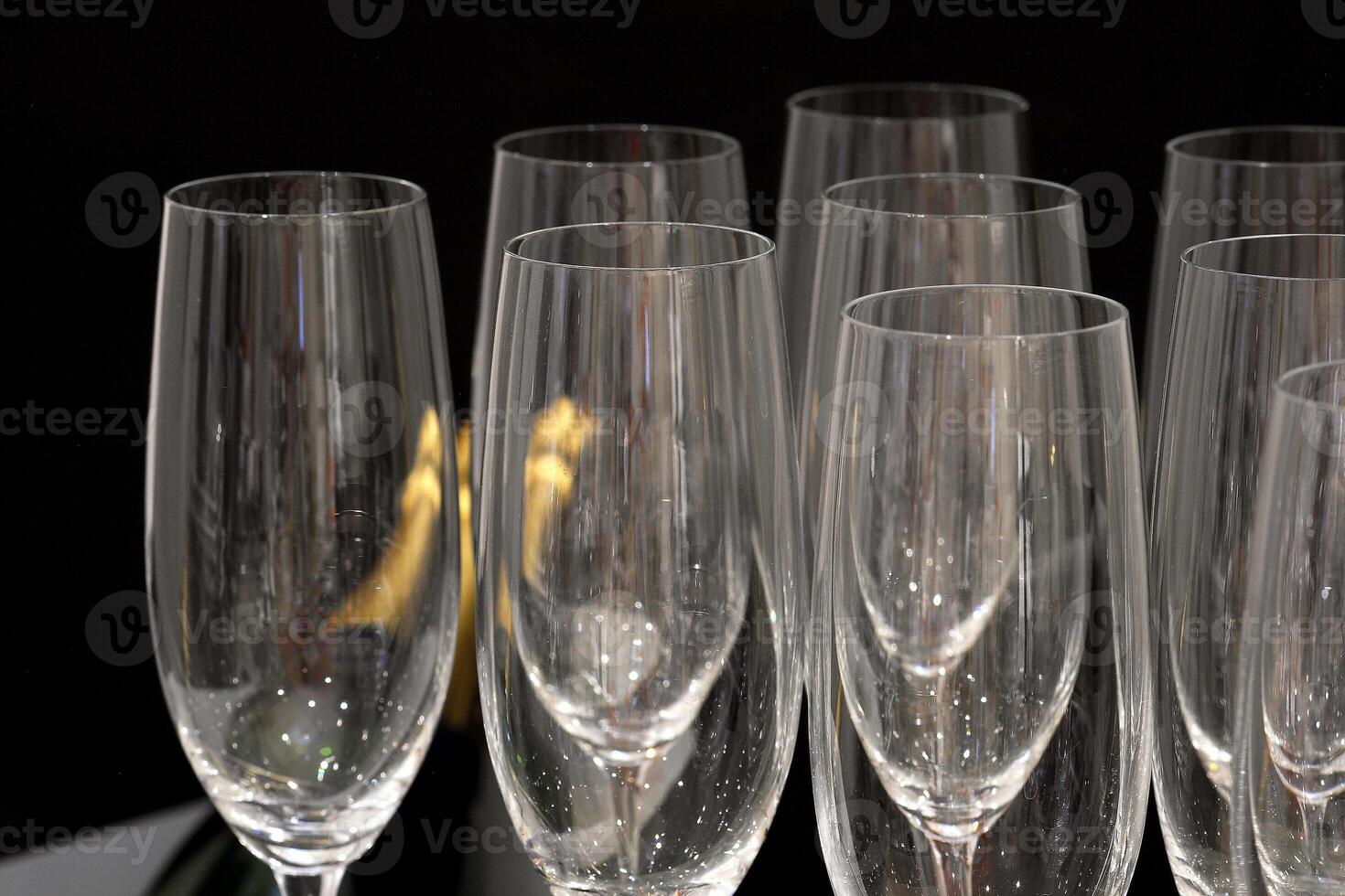 sophisticated tables with plates, cutlery and fine glasses close-up photo