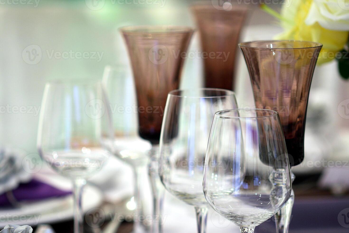 sophisticated tables with plates, cutlery and fine glasses close-up photo