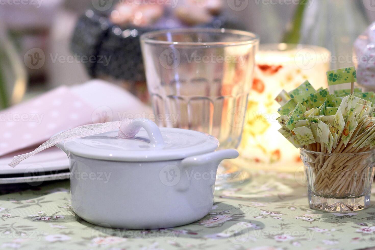 sophisticated tables with plates, cutlery and fine glasses close-up photo