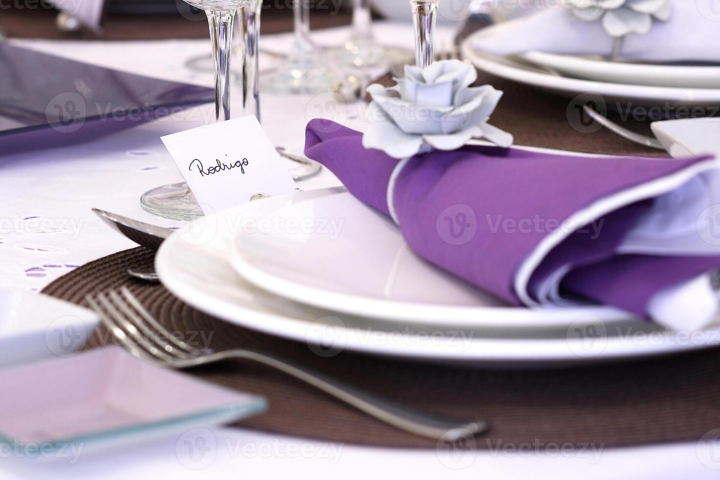 sophisticated tables with plates, cutlery and fine glasses close-up photo