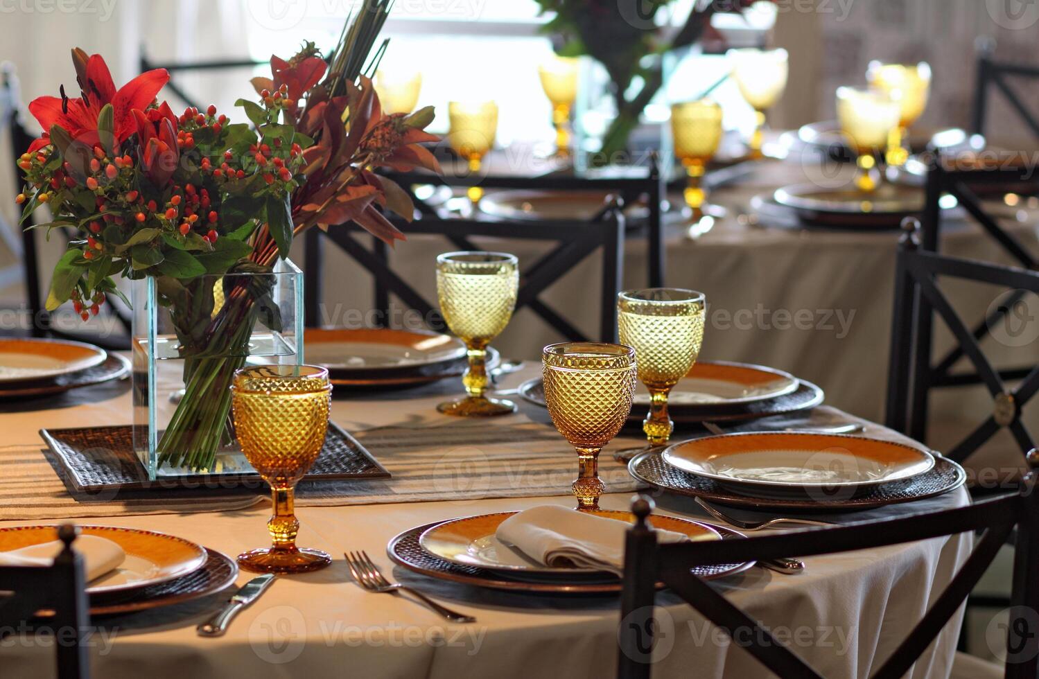 sophisticated table arrangements with yellow jackfruit glasses photo