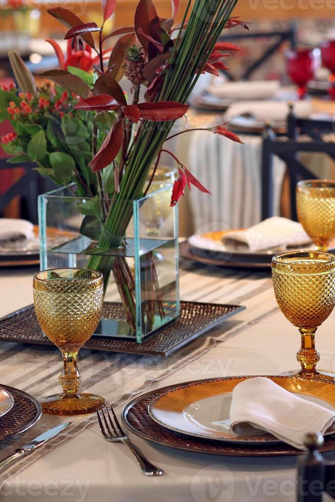 sophisticated table arrangements with yellow jackfruit glasses photo