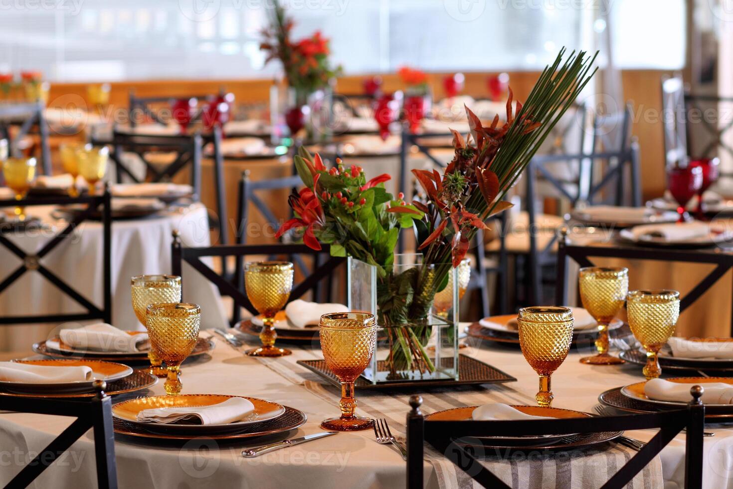 sophisticated table arrangements with yellow jackfruit glasses photo