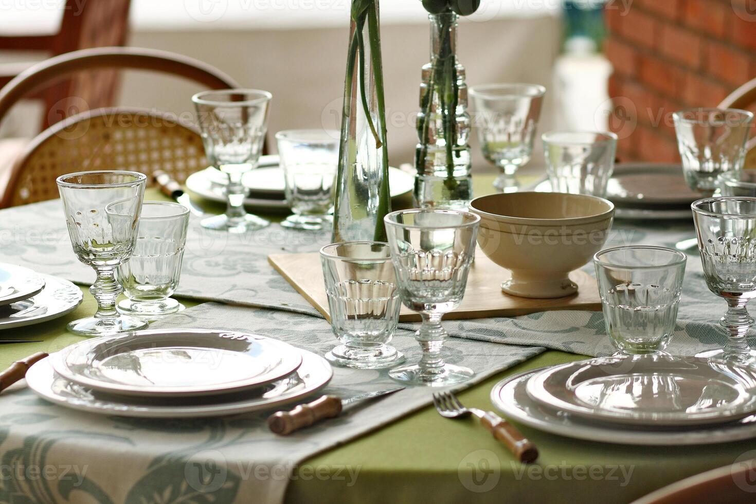 creative and informal table set up outside the house with all the details photo