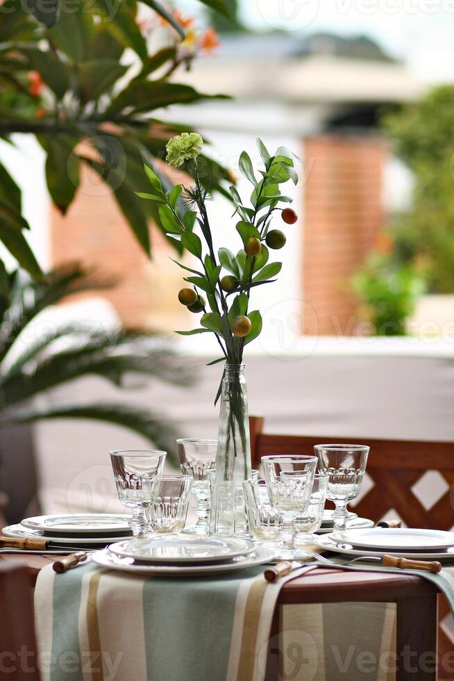 creative and informal table set up outside the house with all the details photo