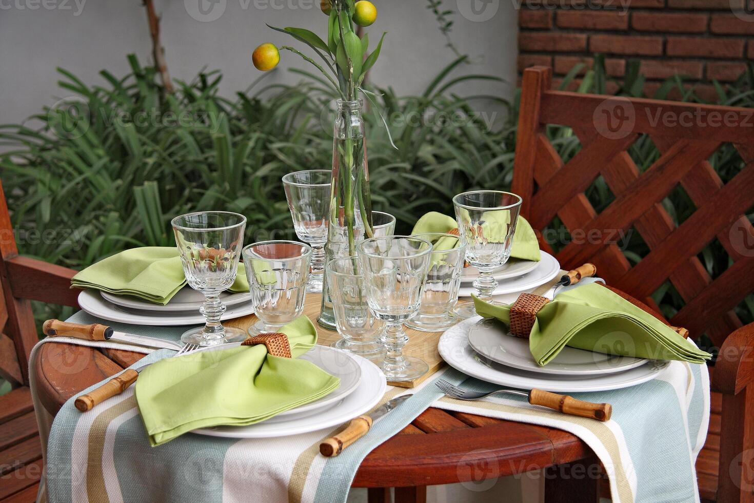 creative and informal table set up outside the house with all the details photo