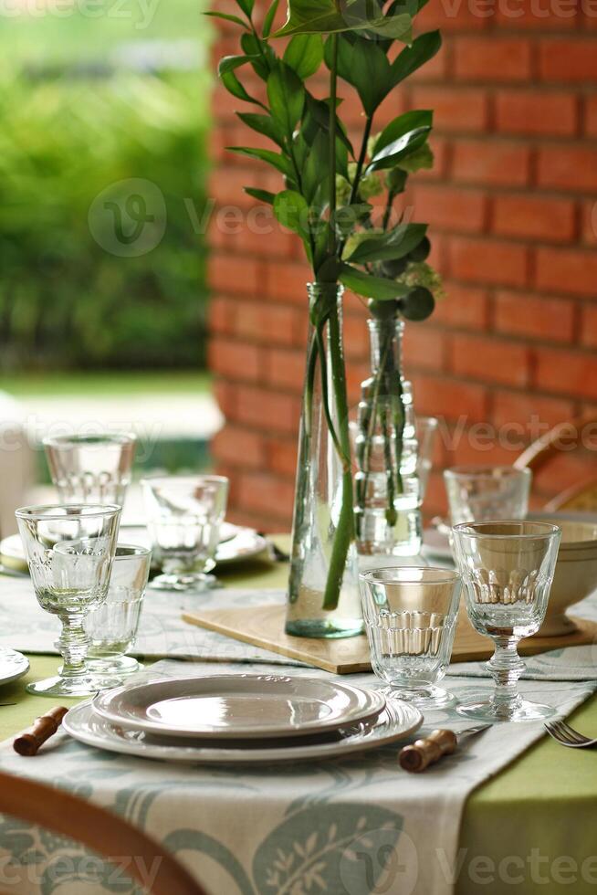 creative and informal table set up outside the house with all the details photo