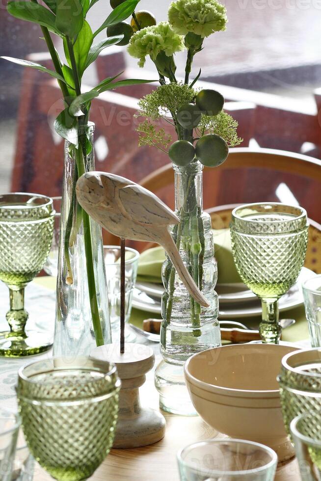 creative and informal table set up outside the house with all the details photo