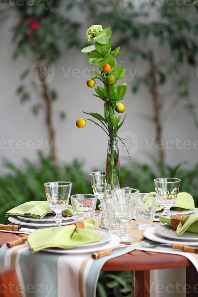 creative and informal table set up outside the house with all the details photo