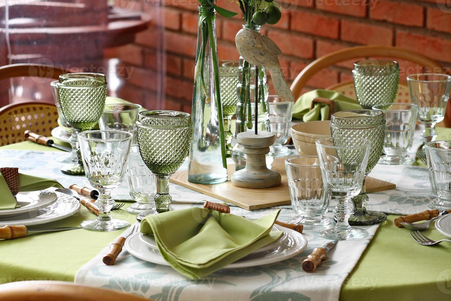 creative and informal table set up outside the house with all the details photo