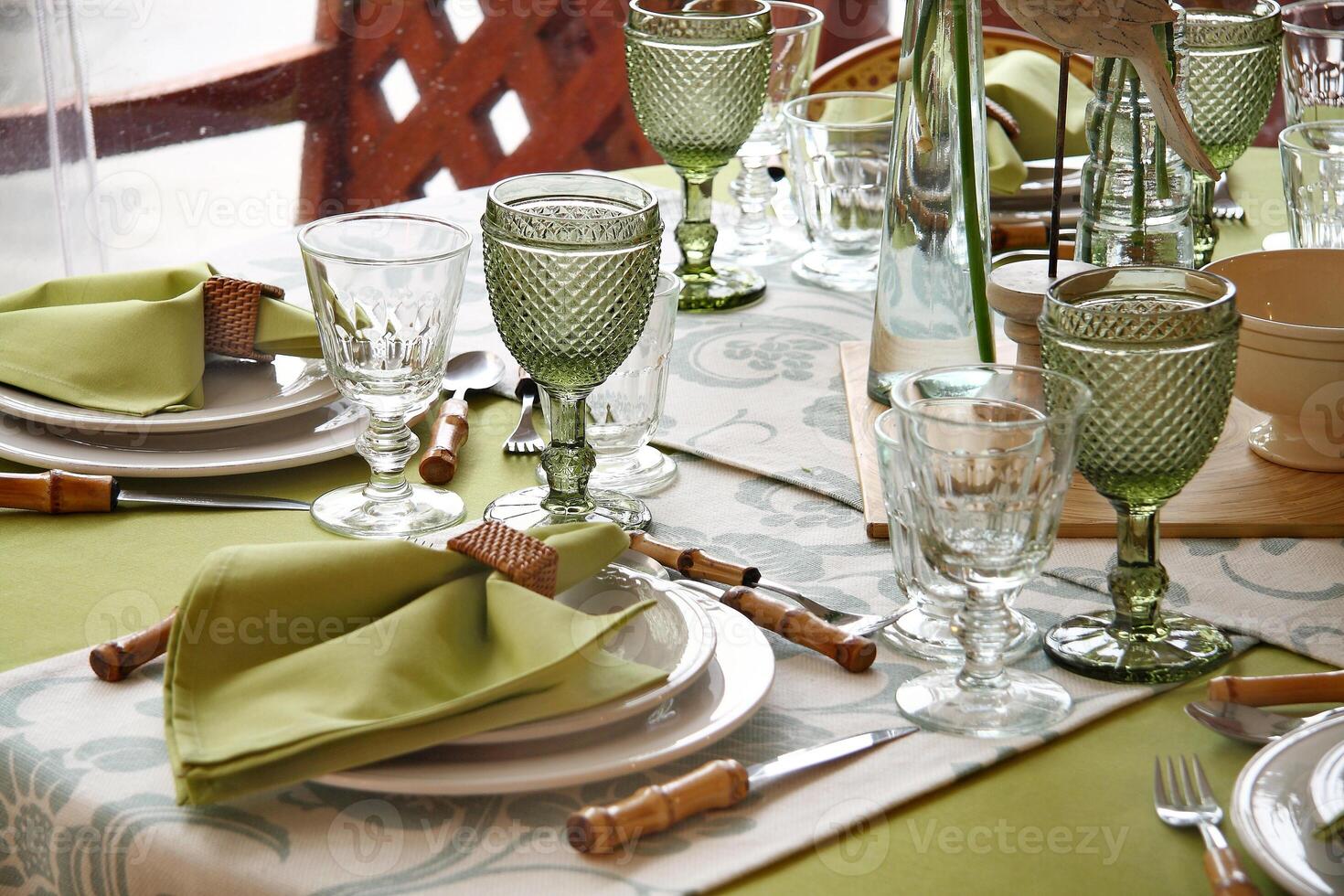 creative and informal table set up outside the house with all the details photo