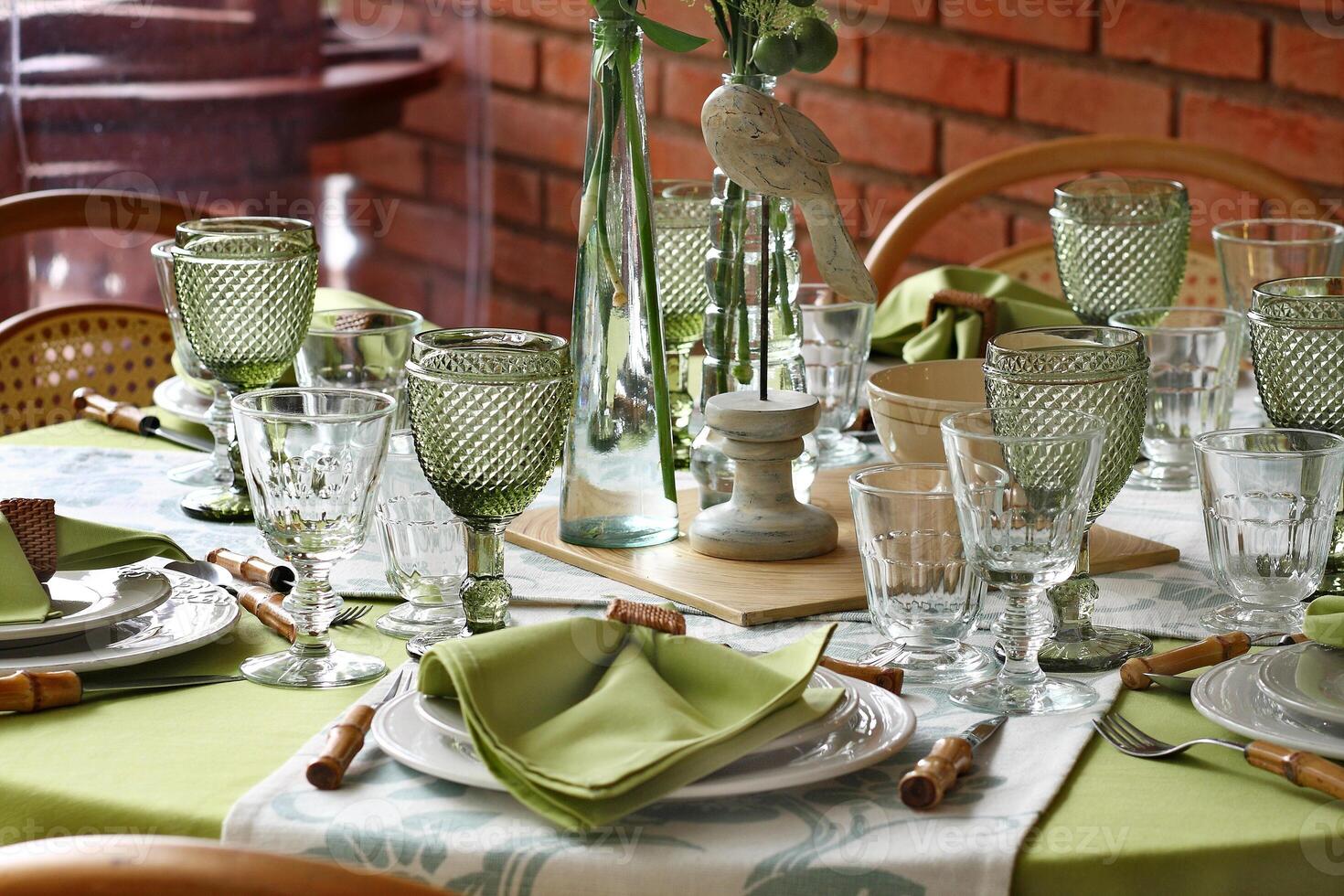 creative and informal table set up outside the house with all the details photo