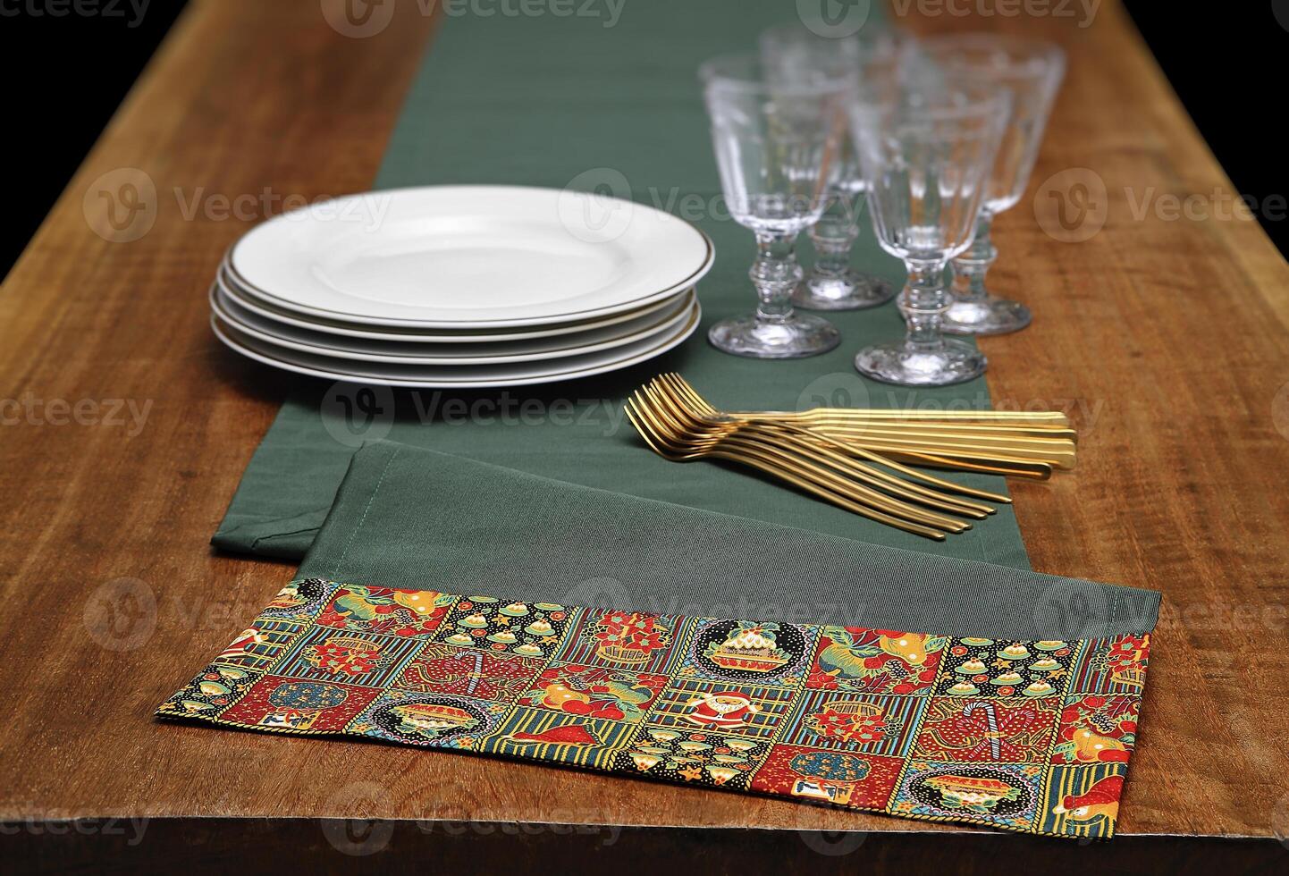 assembly with tablecloths, bowls, plates and glasses for the Christmas table photo