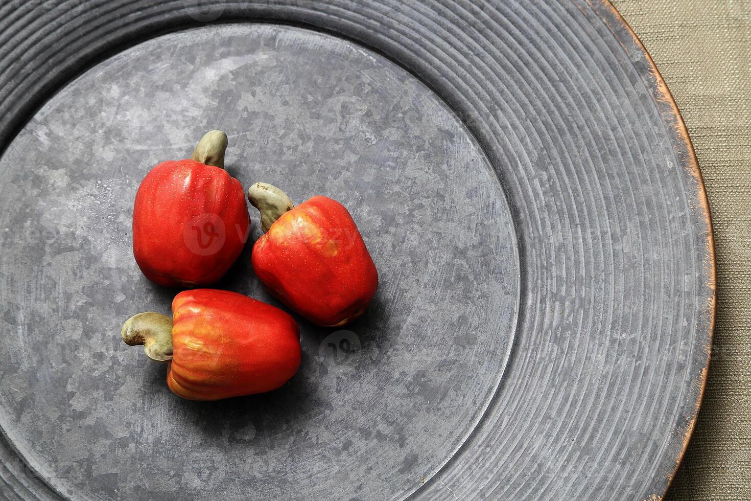 tender cashews inside a beautiful blue ceramic dish photo