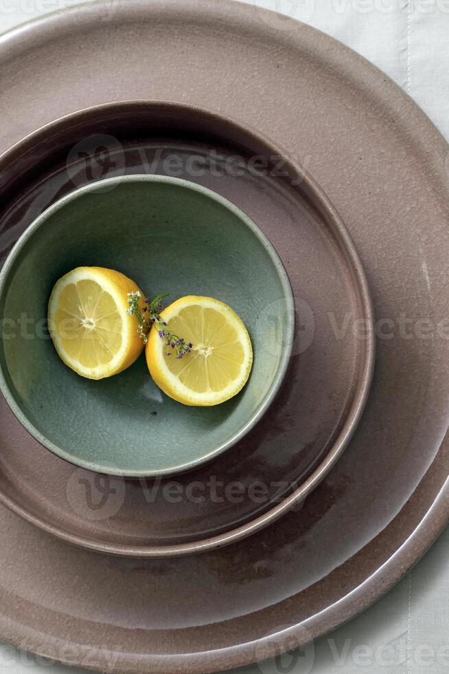 beautiful ceramic dishes with Sicilian lemons photo