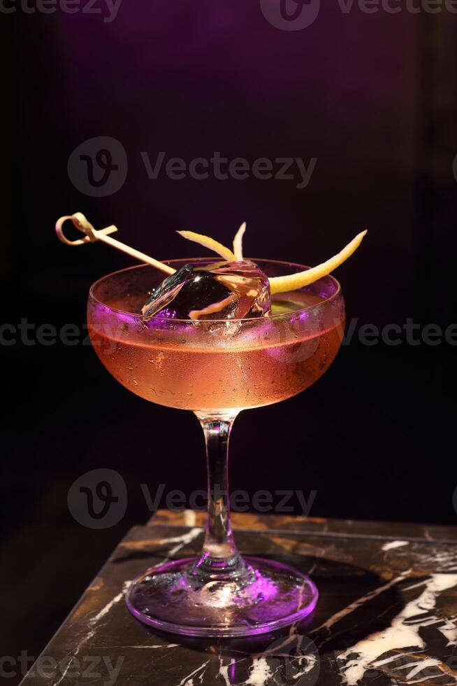 Cardinale, delicious drink with gin, red bitter liqueur and dry vermouth in a glass with ice photo