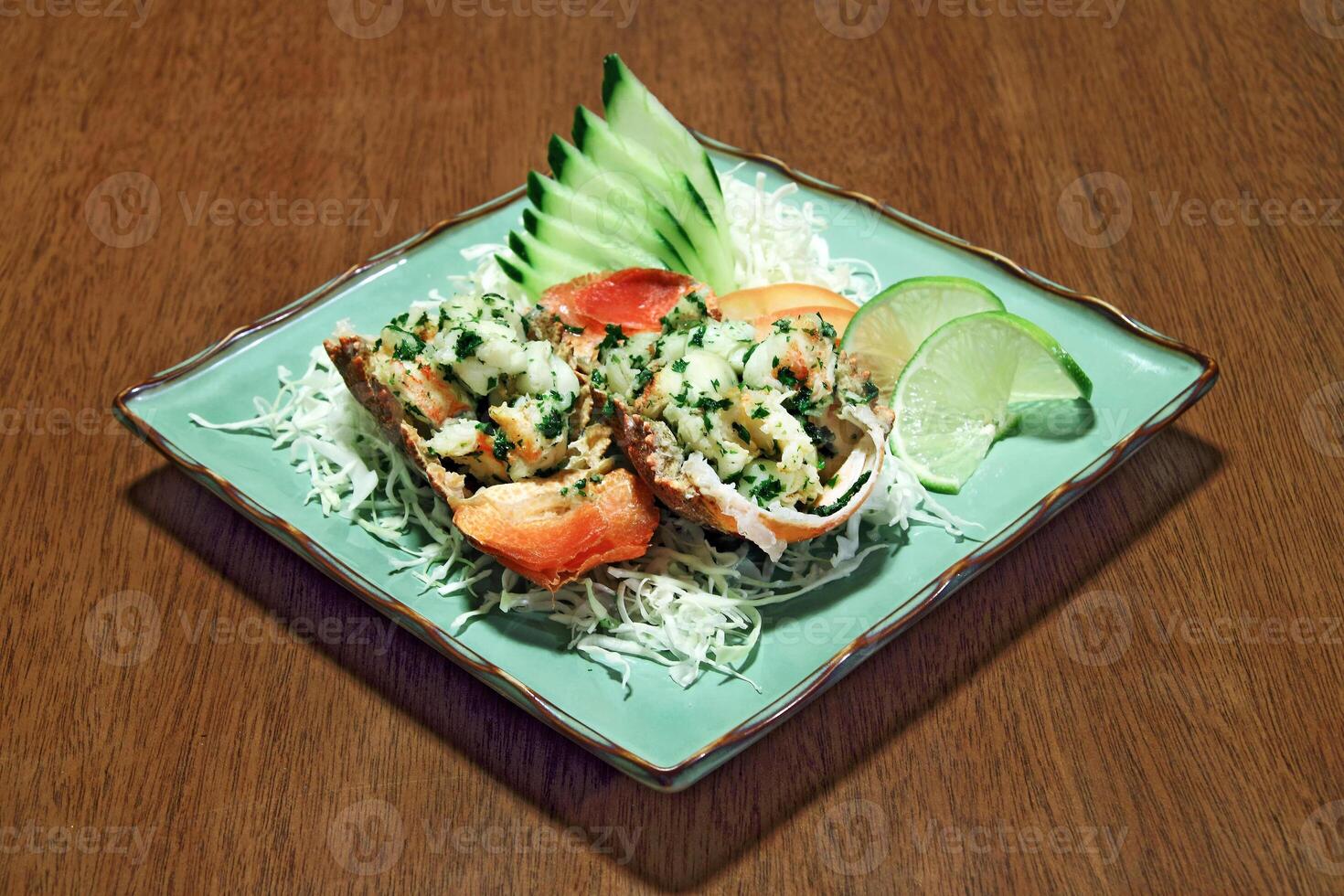 Roasted crayfish with lemon on plate photo