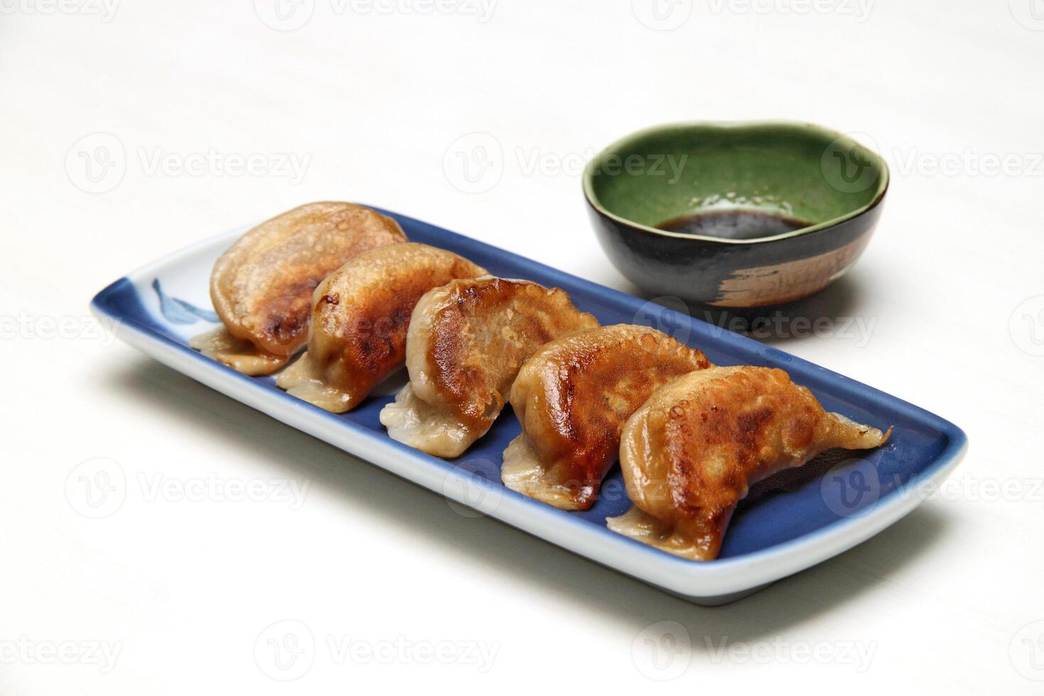 Guioza, Japanese dumpling with a filling of pork, ginger, cabbage, garlic and special sauce to accompany photo