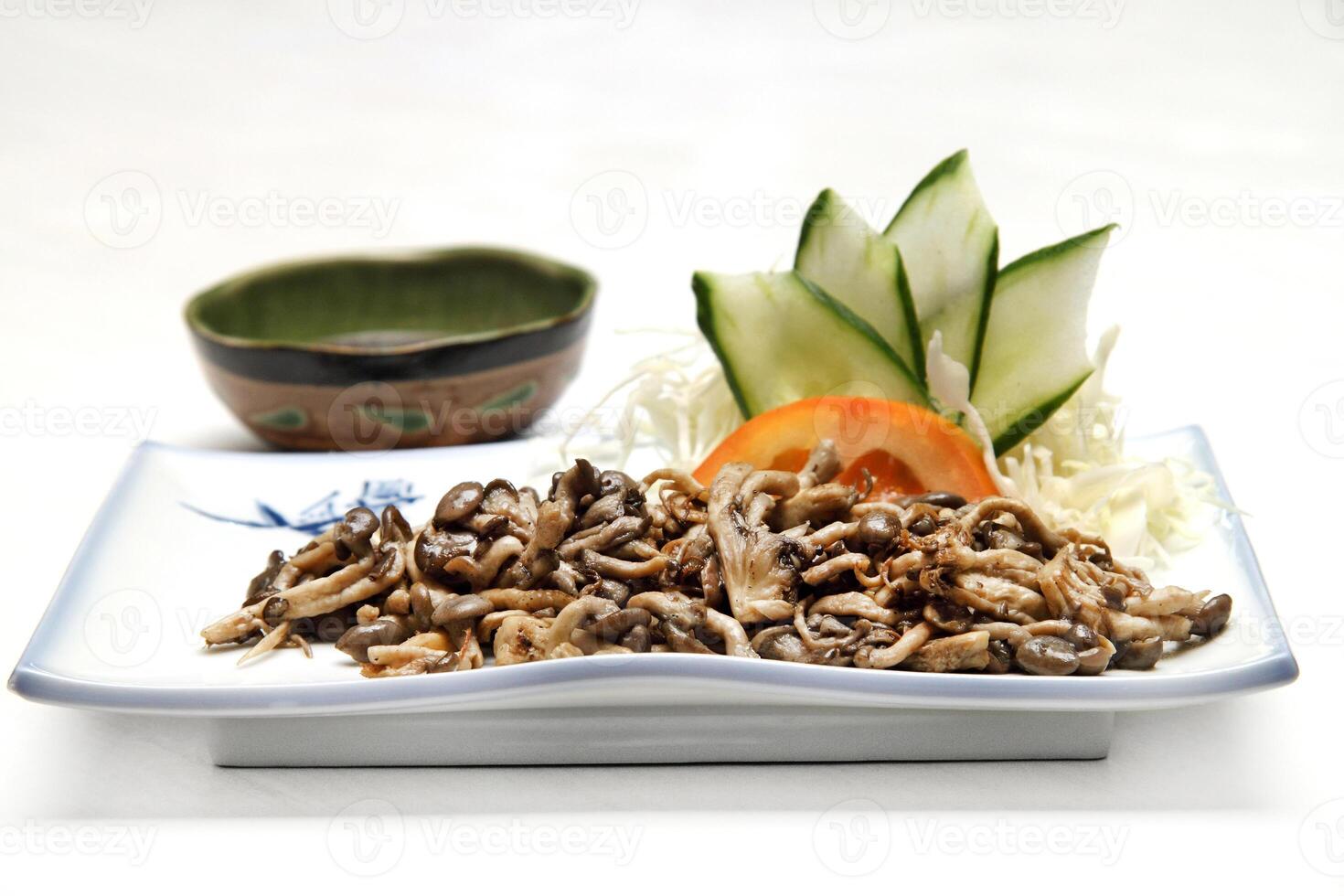 Shimeji, type of mushroom with butter, chives, garlic, soy sauce, sugar and oil photo