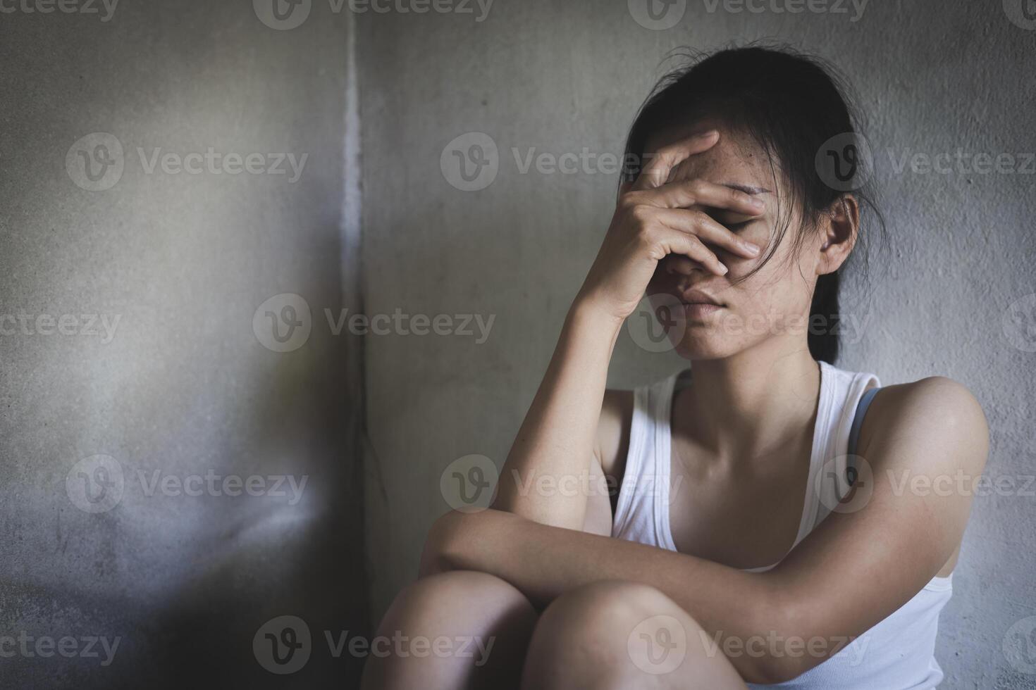 Young depressed woman, domestic and rape violence,beaten and raped sitting in the corner, Domestic violence. Copy space. photo