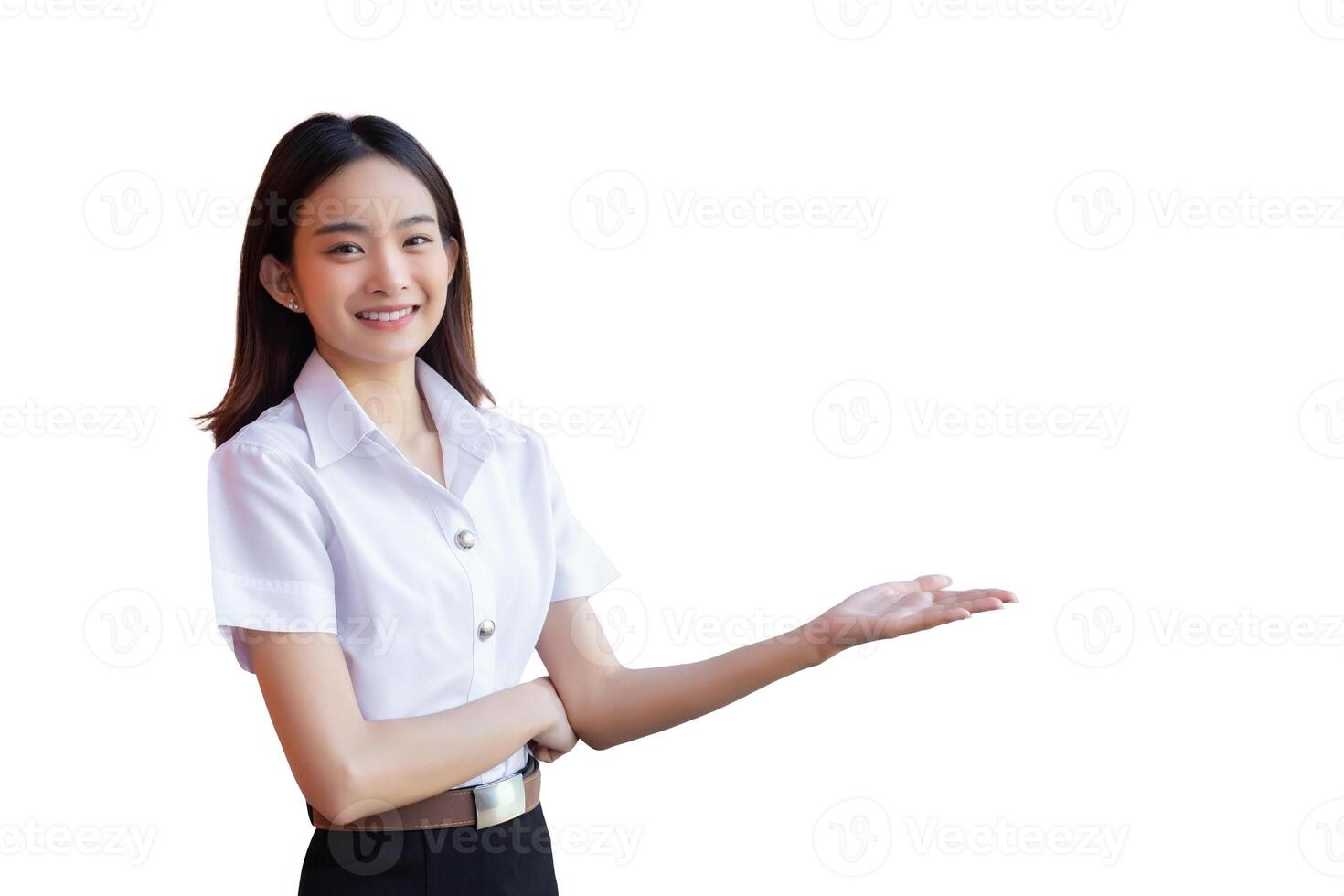 Asian beautiful young woman student is smiling and looking at camera standing to present something confidently in university while isolated white background. photo