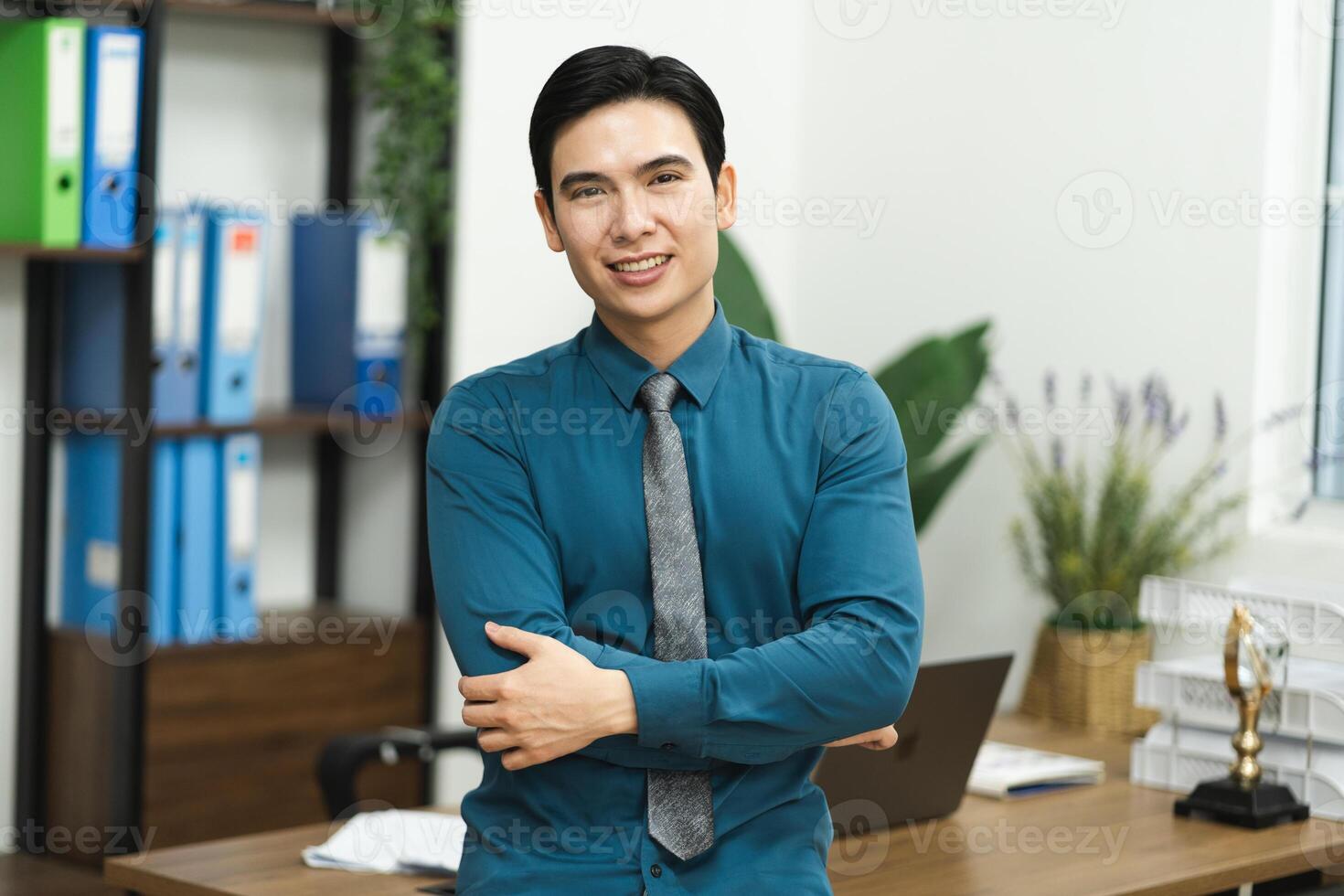 Image of Asian male businessman working in the office photo